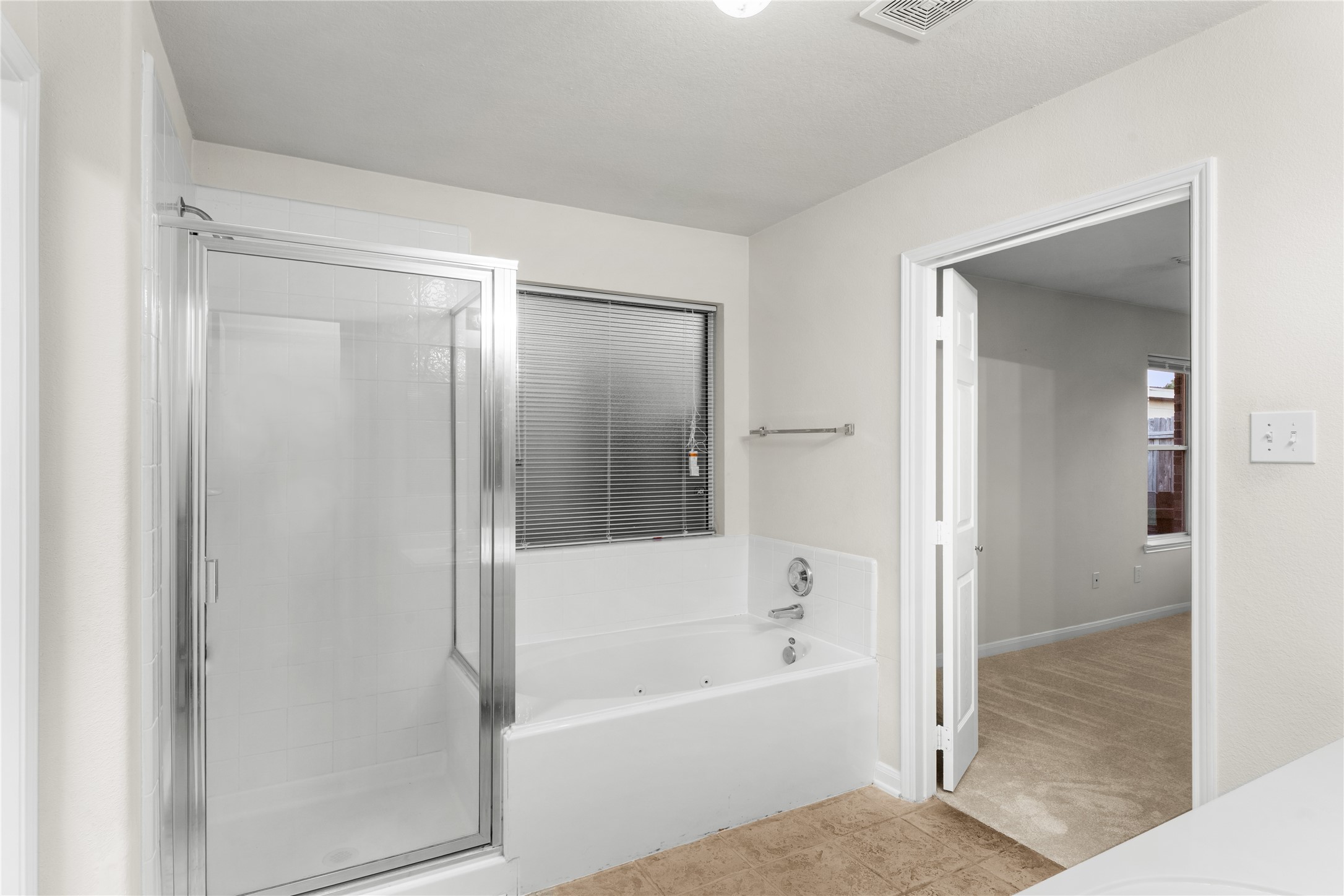 3522 Brackenfern Road Katy, TX 77449 - Photo 19 of 32 a bathroom with a bathtub and a shower