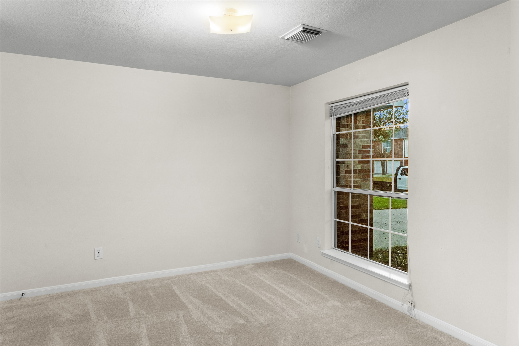 3522 Brackenfern Road Katy, TX 77449 - Photo 8 of 32 an empty room with windows