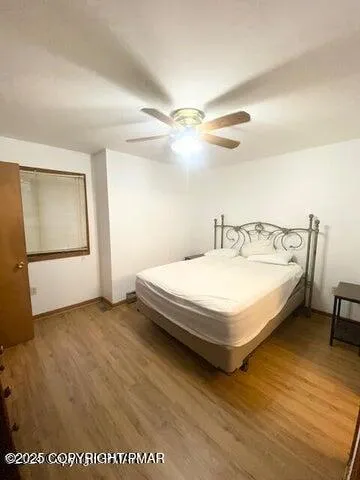 a spacious bedroom with a bed and a table