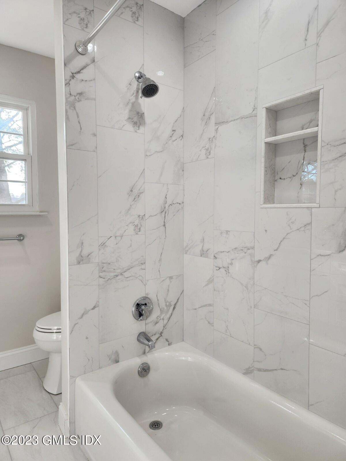 96 Valley Road, Unit 18 Cos Cob, CT 06807 - Photo 15 of 24 a bathroom with a bathtub and a toilet