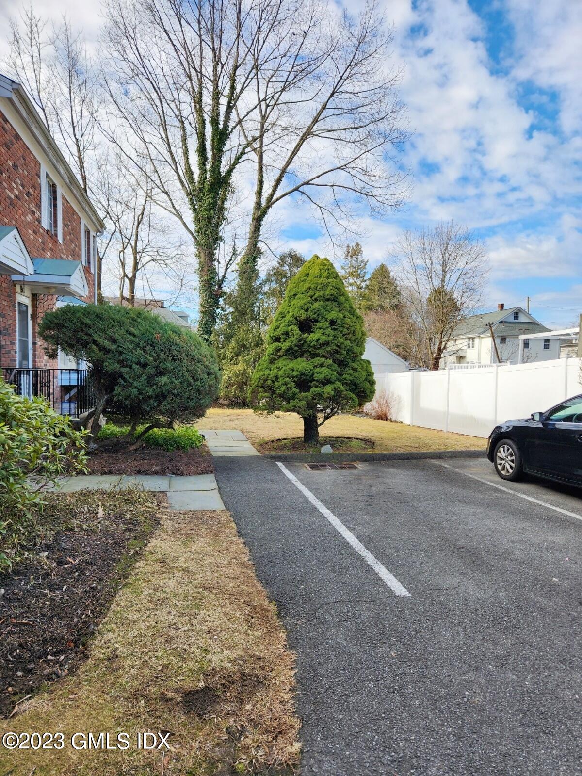 96 Valley Road, Unit 18 Cos Cob, CT 06807 - Photo 2 of 24 a view of a back yard of the house
