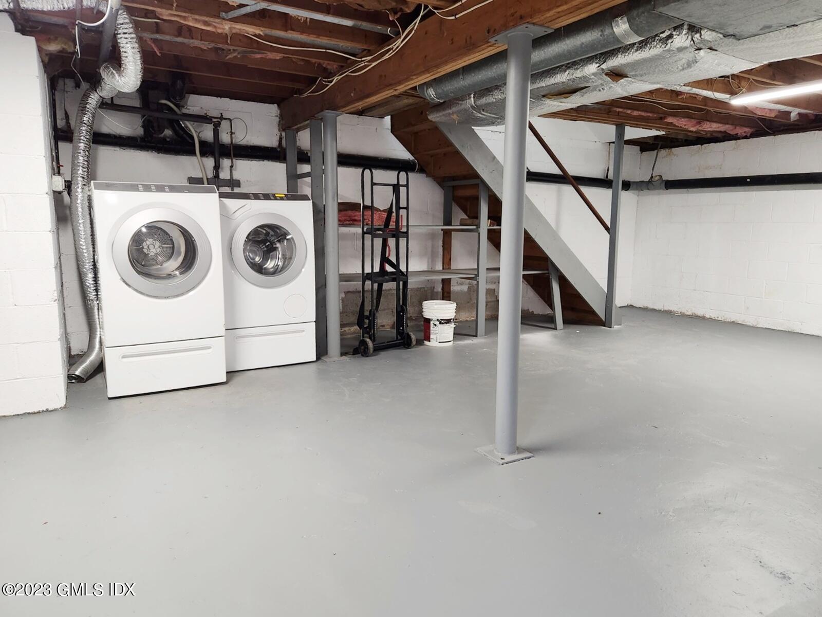 96 Valley Road, Unit 18 Cos Cob, CT 06807 - Photo 22 of 24 a utility room with dryer and washer