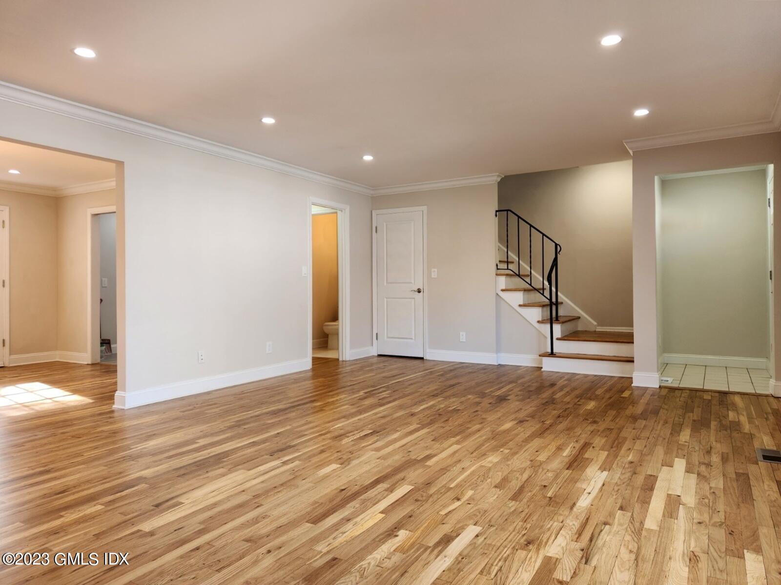 96 Valley Road, Unit 18 Cos Cob, CT 06807 - Photo 3 of 24 a view of an empty room with wooden floor