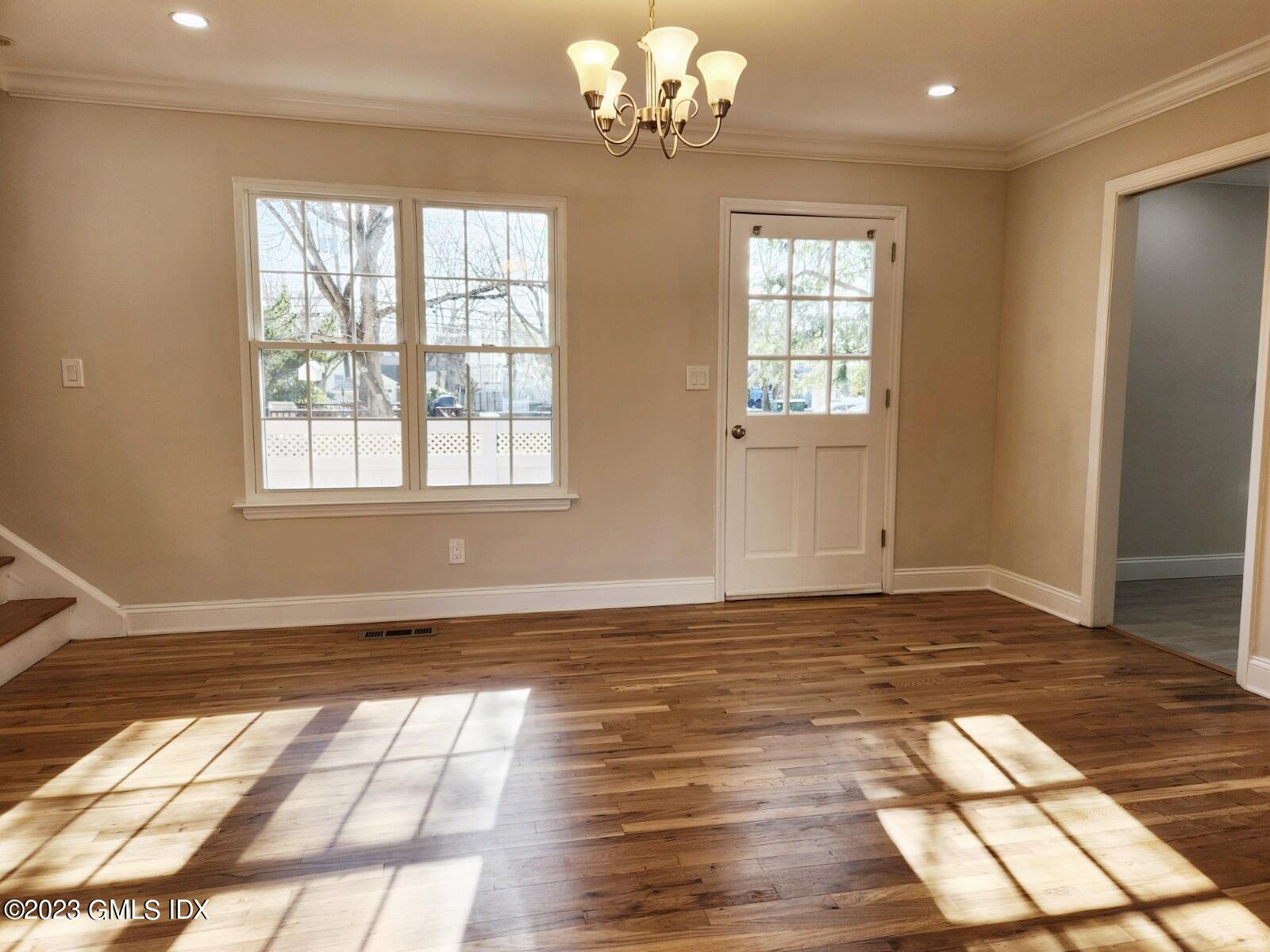96 Valley Road, Unit 18 Cos Cob, CT 06807 - Photo 10 of 24 a view of an empty room with wooden floor and fan