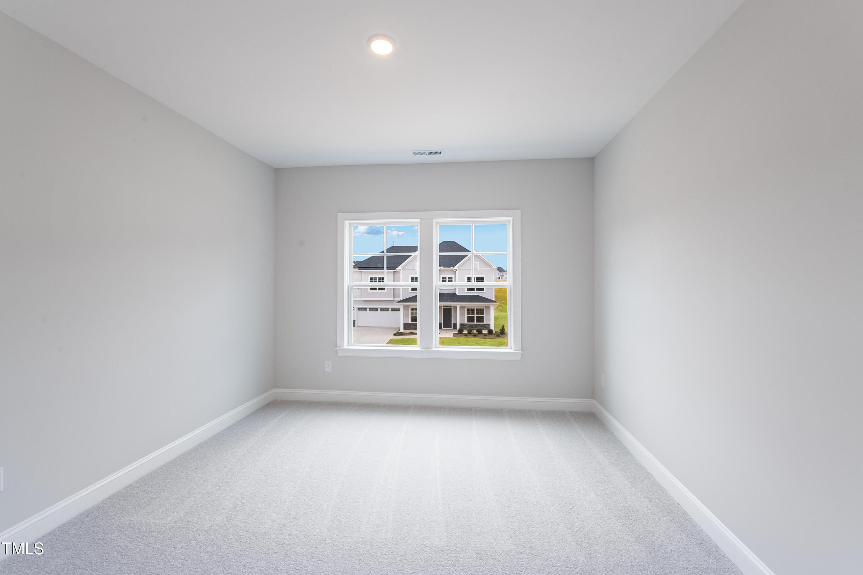 150 East Stanton Street Garner, NC 27529 - Photo 16 of 18 an empty room with windows