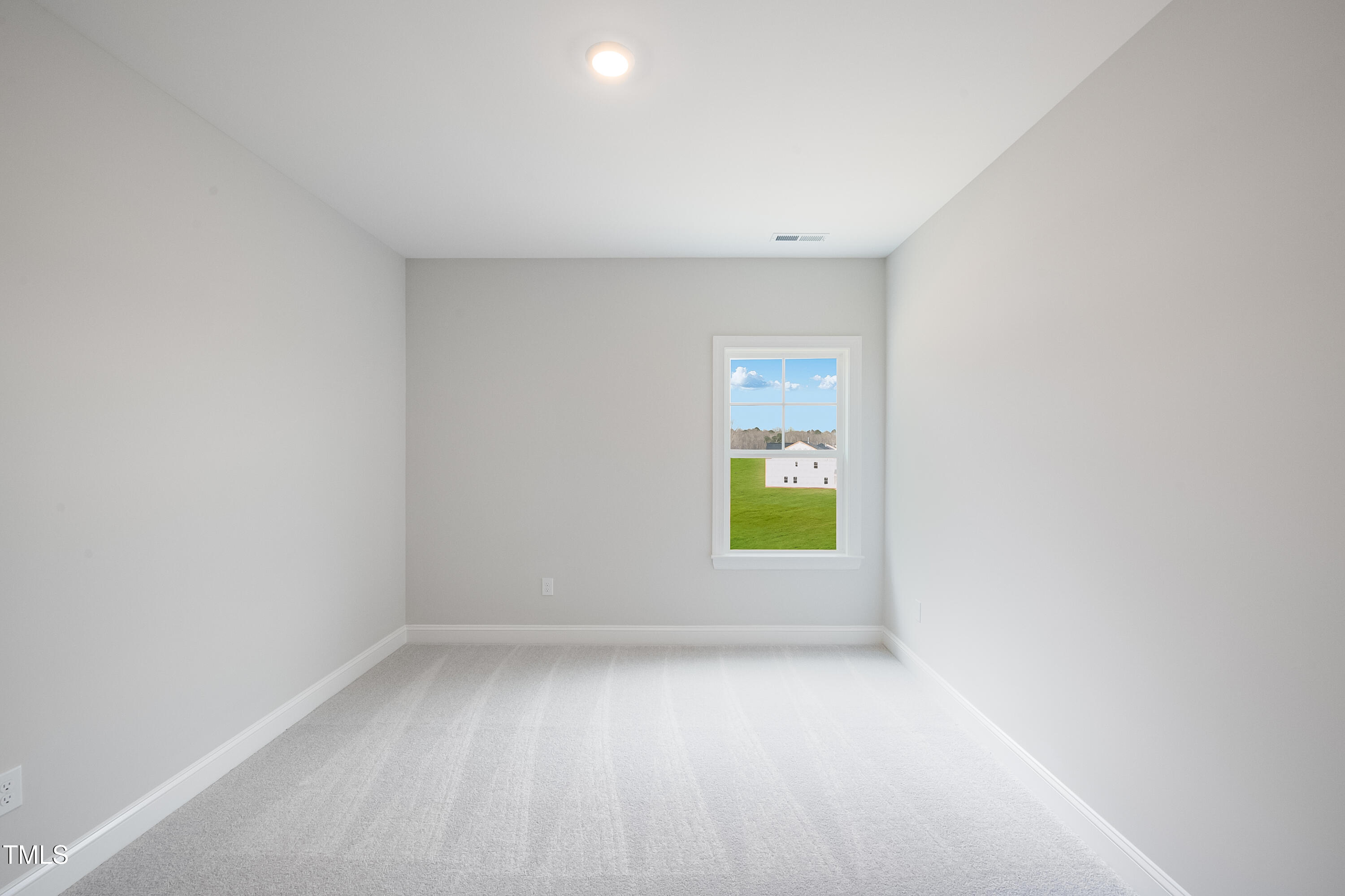 150 East Stanton Street Garner, NC 27529 - Photo 17 of 18 a view of an empty room and a window