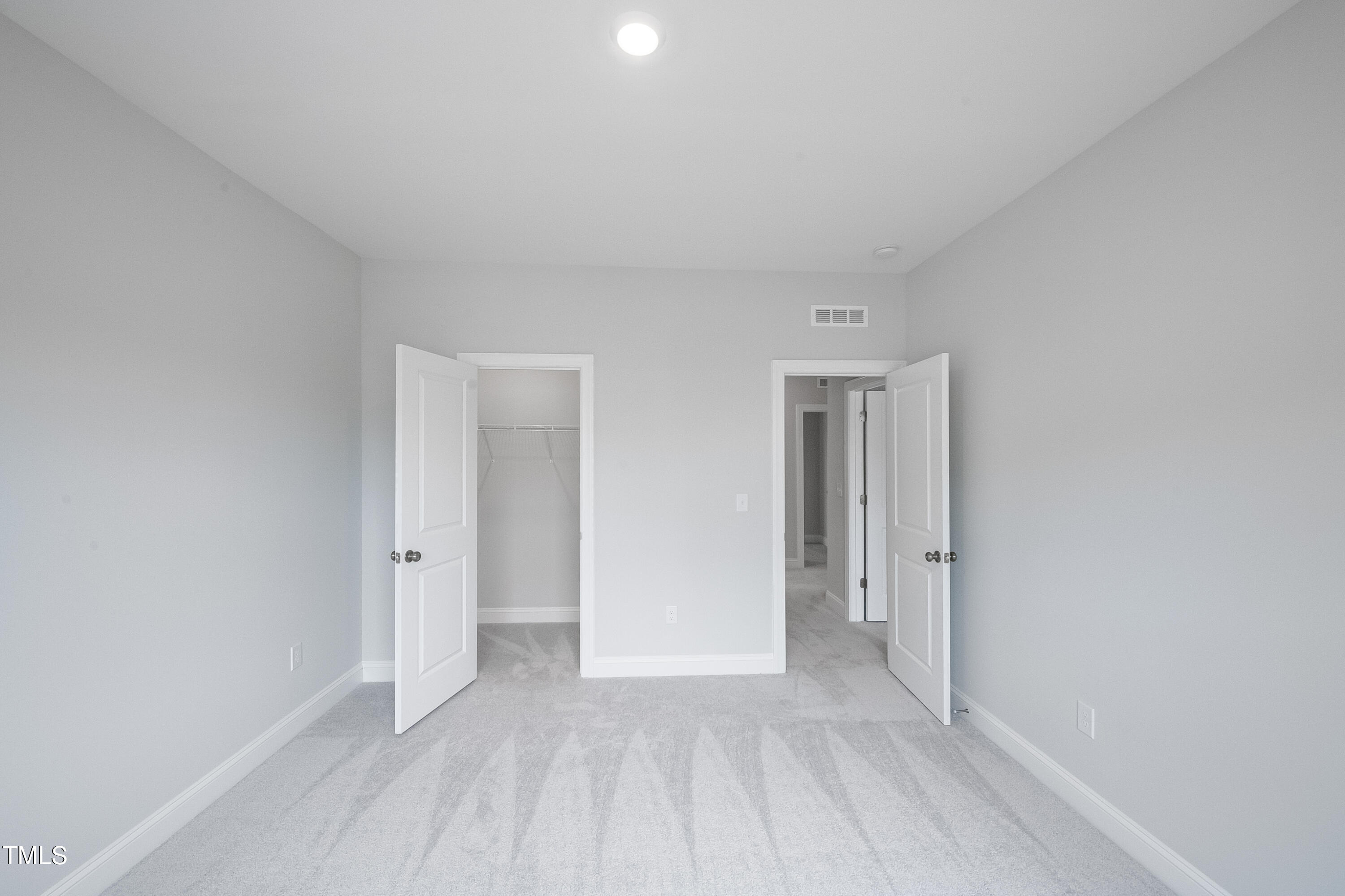 150 East Stanton Street Garner, NC 27529 - Photo 18 of 18 a view of an empty room and closet area