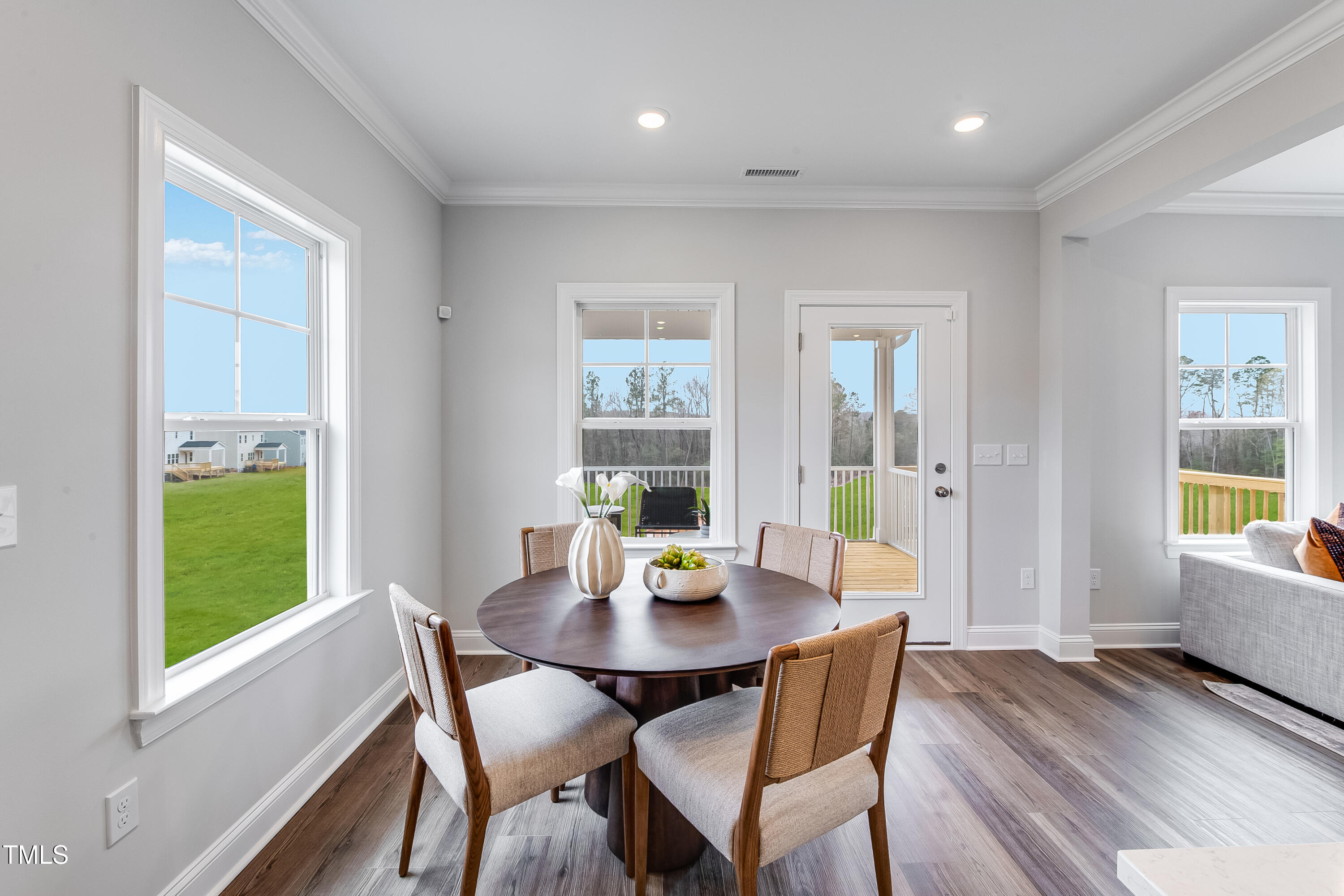 150 East Stanton Street Garner, NC 27529 - Photo 6 of 18 a view of a dining room with furniture window and wooden floor