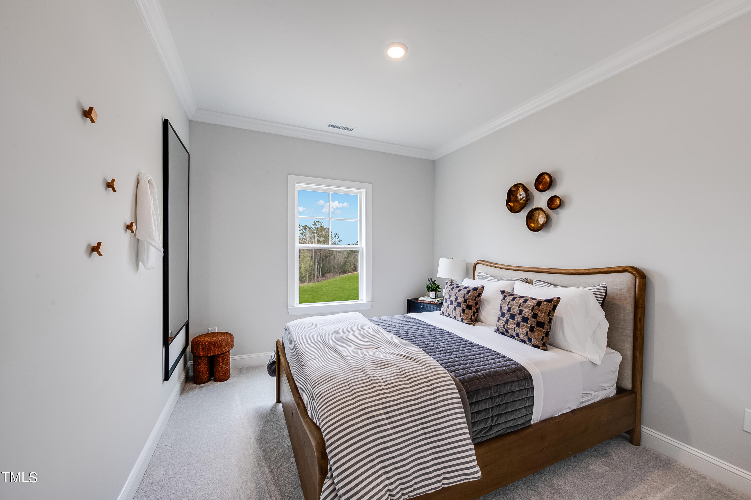 150 East Stanton Street Garner, NC 27529 - Photo 8 of 18 a bedroom with bed and a window