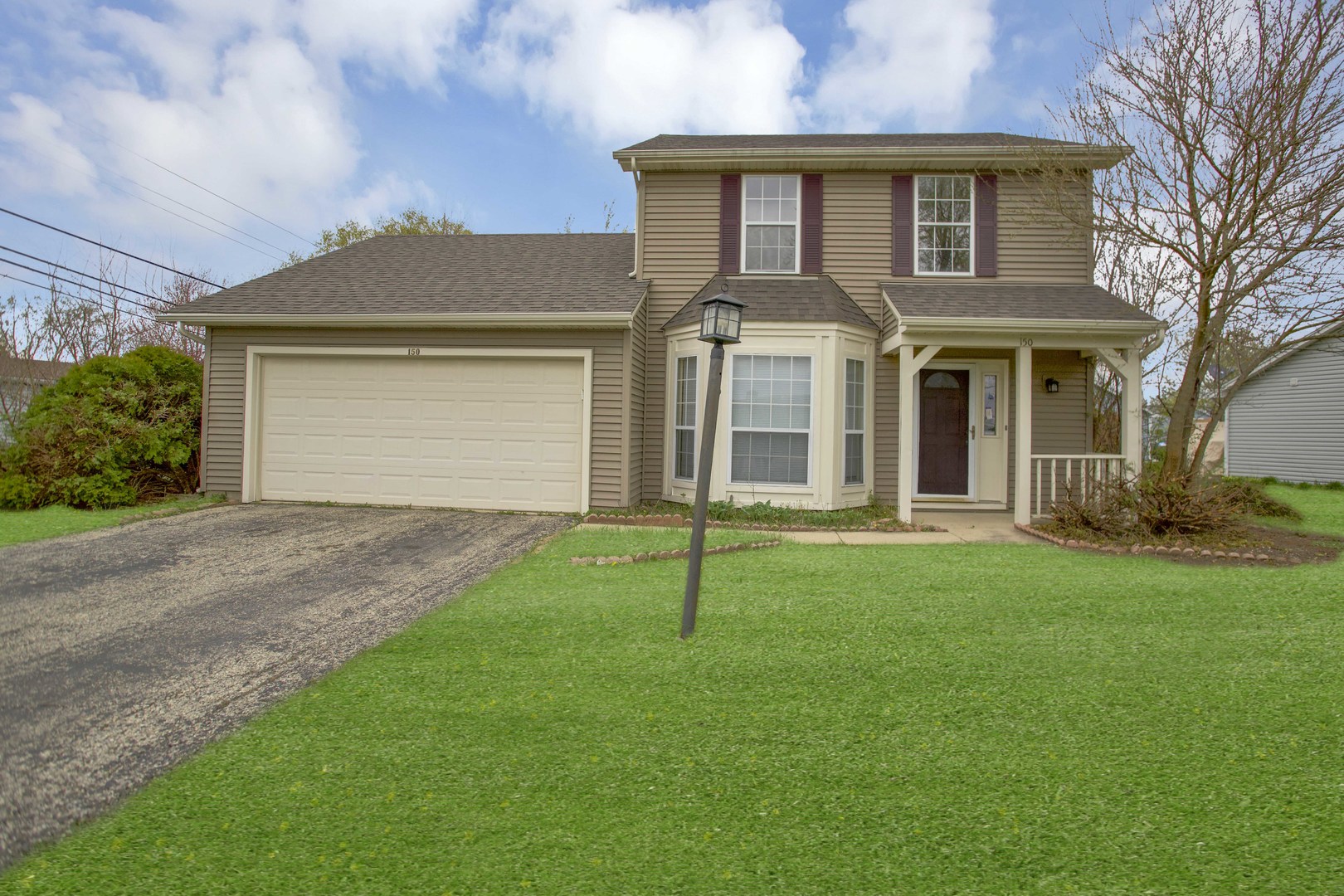 150 Seton Place Streamwood, IL 60107 - Photo 1 of 2 front view of a house with a yard