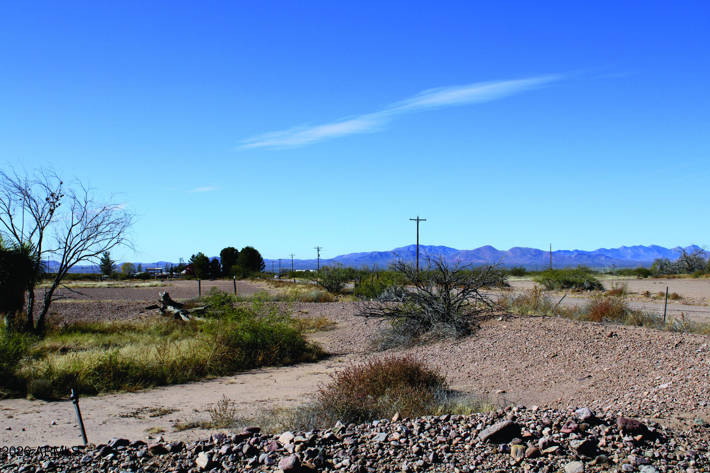 4.25-ac Thompson Road, Unit A Elfrida, AZ 85610 - Photo 28 of 34 a view of a lake with mountains in the background