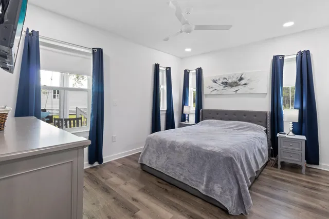 a bedroom with a large bed and a dresser