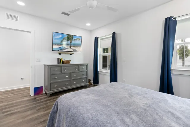 a bedroom with a bed and a dresser