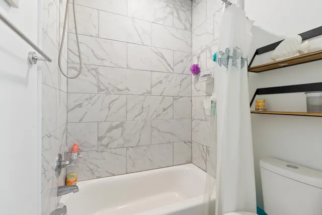 a bathroom with a white bathtub
