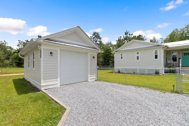 a view of a house with swimming pool and porch with furniture
