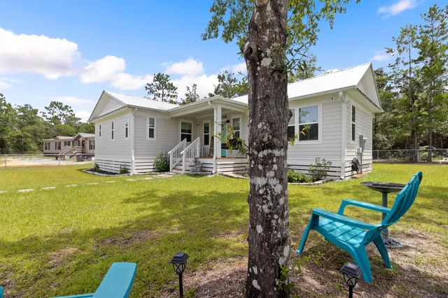 a view of a house with a big yard