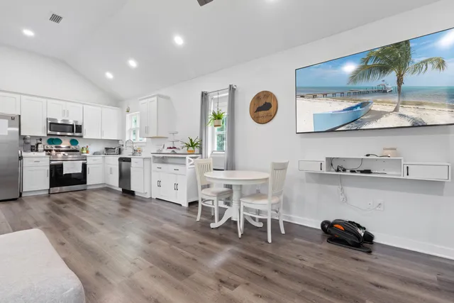 a kitchen with a sink and cabinets