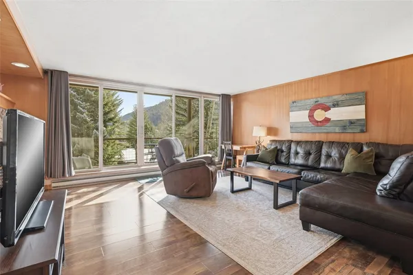 a living room with furniture and a large window