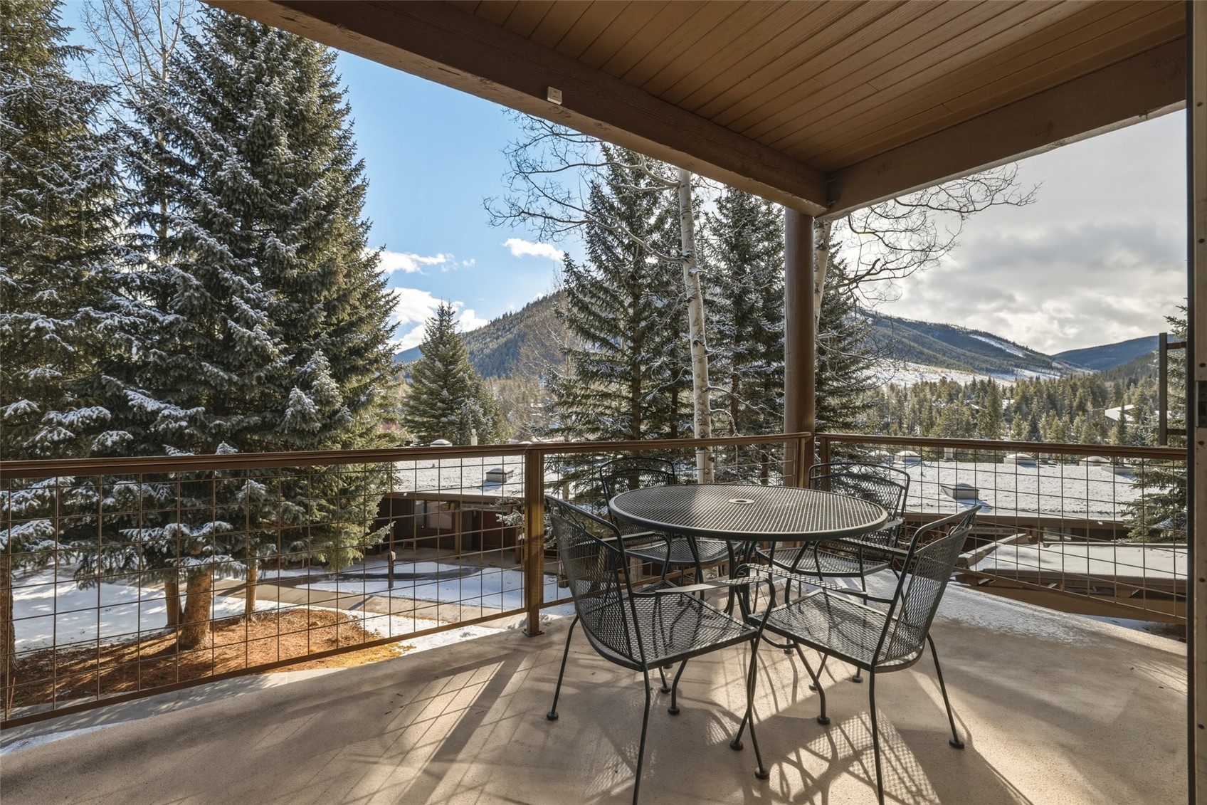 21700 Highway 6, Unit 2015 Keystone, CO 80435 - Photo 18 of 50 a view of a patio with a table and chairs