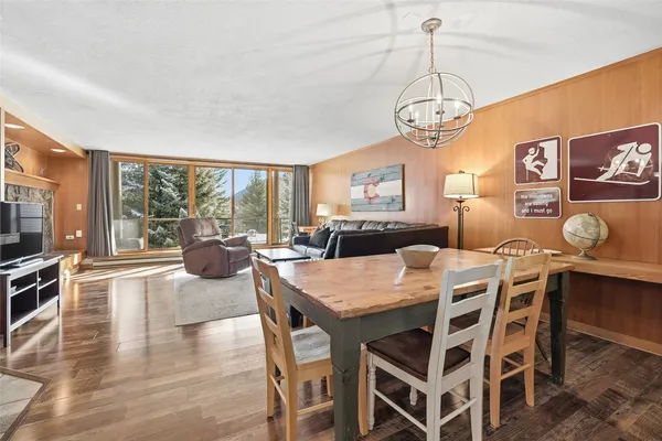 a view of a dining room with furniture window and wooden floor