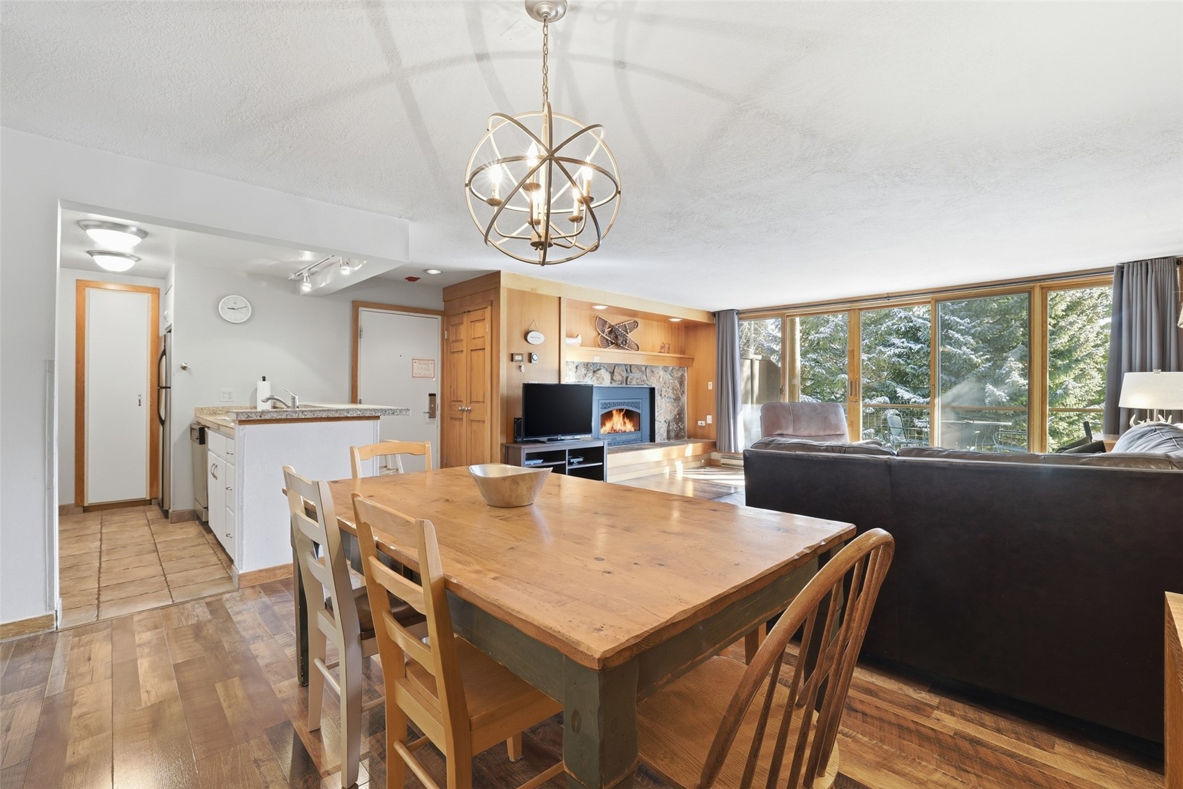 21700 Highway 6, Unit 2015 Keystone, CO 80435 - Photo 21 of 50 a view of a dining room with furniture window and wooden floor