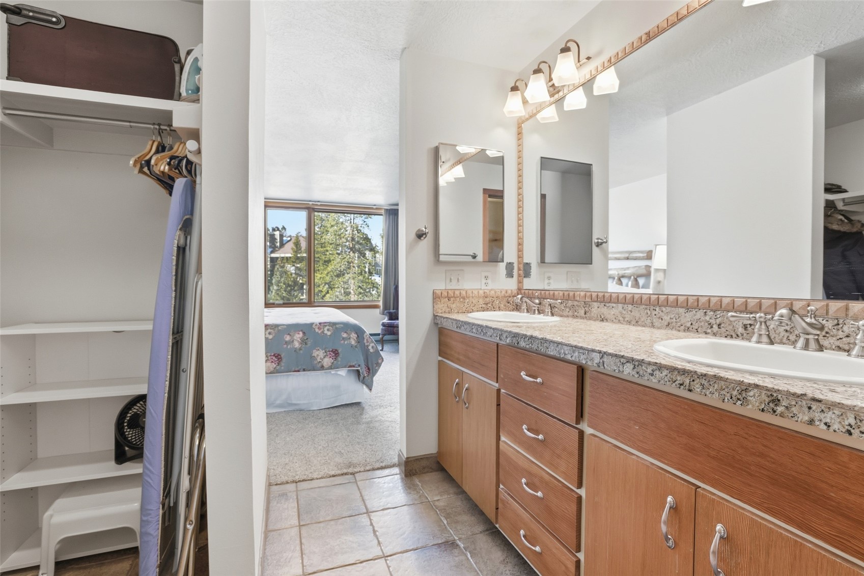21700 Highway 6, Unit 2015 Keystone, CO 80435 - Photo 37 of 50 a spacious bathroom with a granite countertop sink a toilet and a mirror