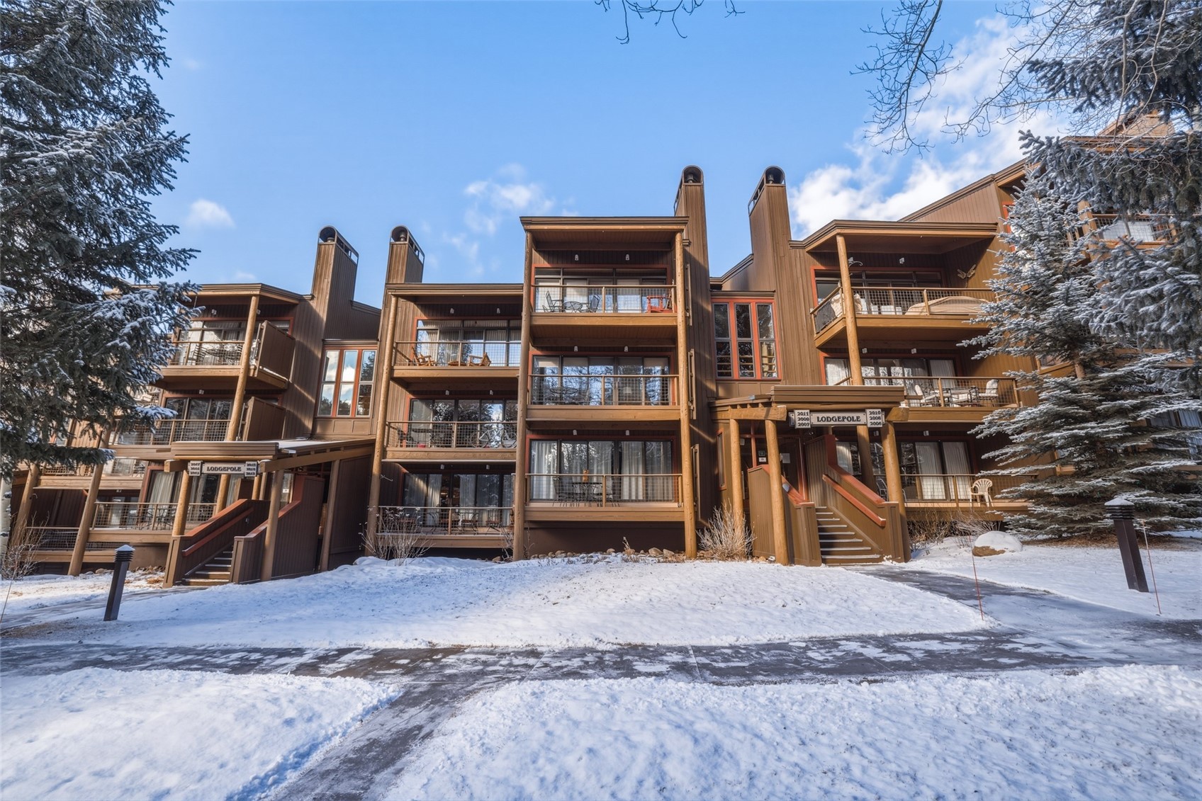 21700 Highway 6, Unit 2015 Keystone, CO 80435 - Photo 4 of 50 a front view of a house with a yard