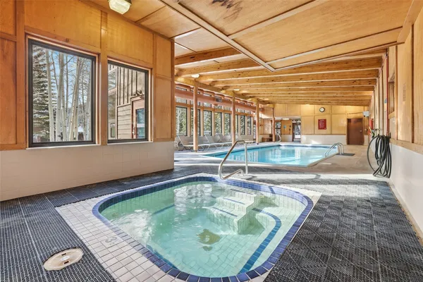 a view of a living room and bedroom