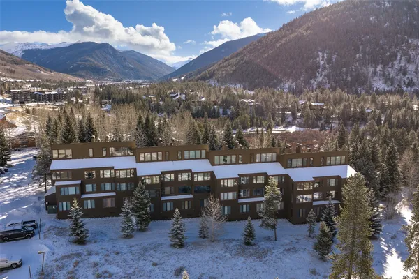 a view of a chairs and table in a backyard