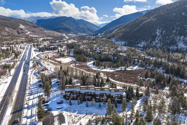 a view of a patio with table and chairs