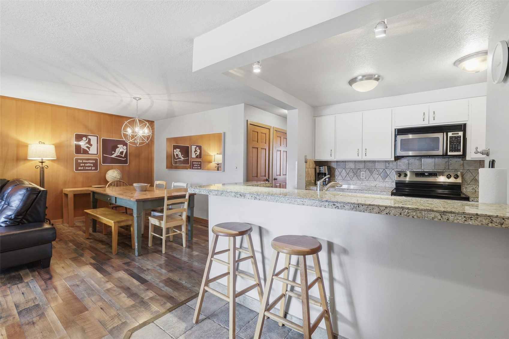 21700 Highway 6, Unit 2015 Keystone, CO 80435 - Photo 5 of 50 a large kitchen with cabinets table and chairs