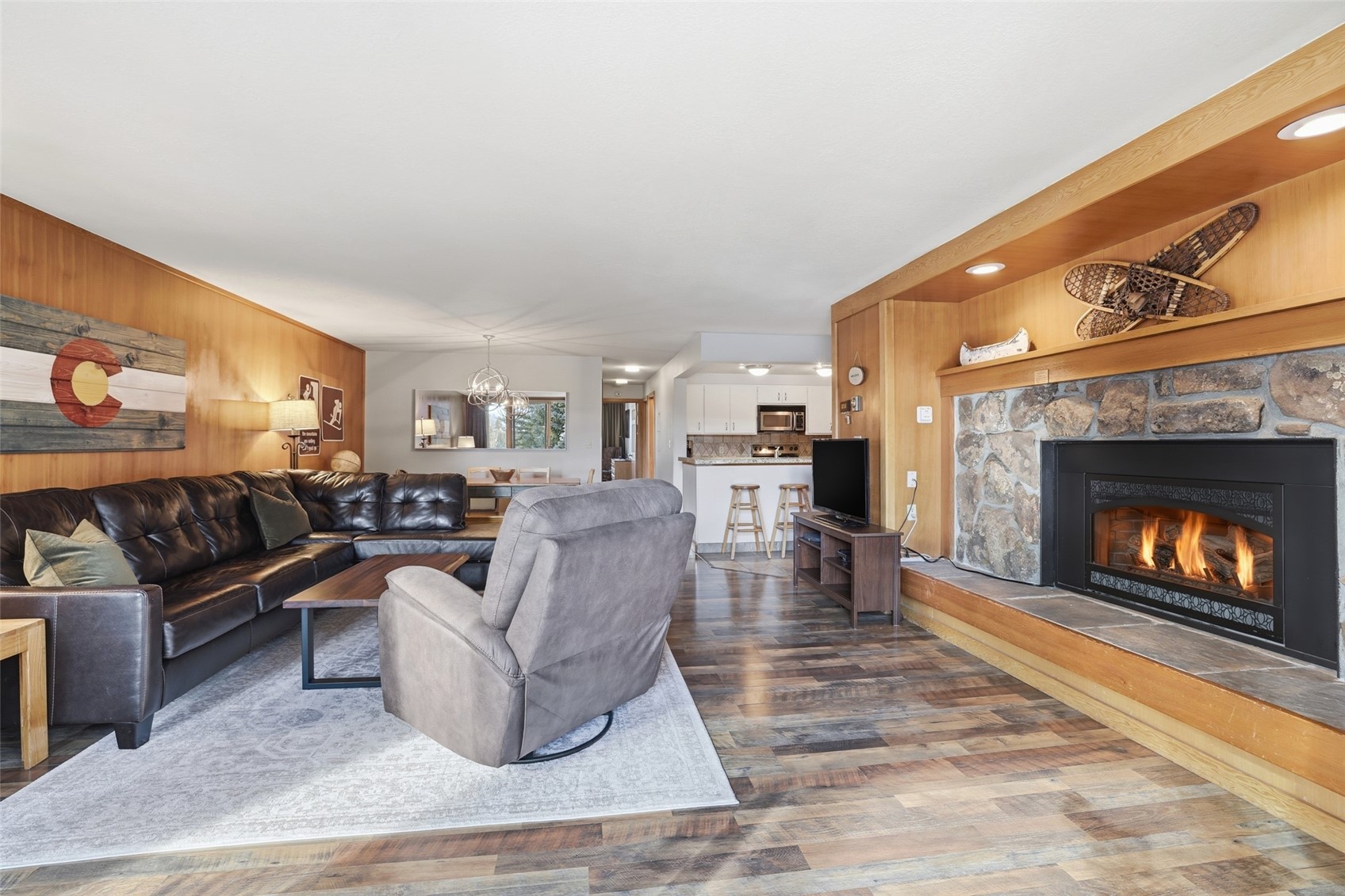 21700 Highway 6, Unit 2015 Keystone, CO 80435 - Photo 7 of 50 a living room with furniture and a fireplace