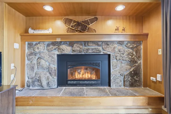 a view of fireplace with wooden floor