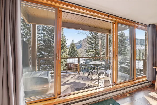 a view of a room that has a glass door