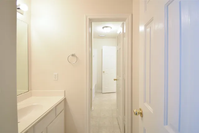 a bathroom with a shower and a sink