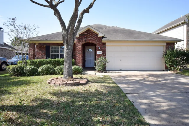 a front view of a house with a yard and an outdoor space