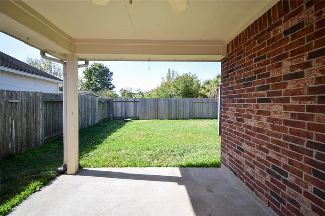 a view of a backyard with pathway