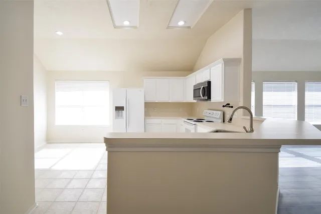a bathroom with a sink a mirror and a bathtub