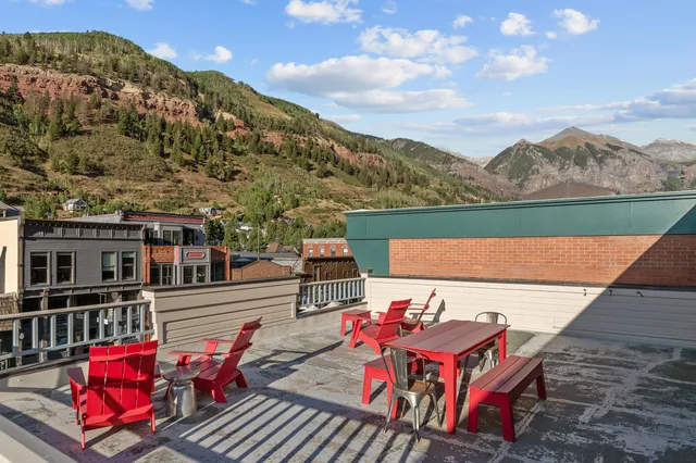 a view of a chairs on the roof deck