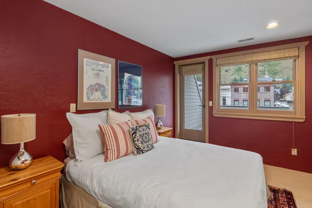 a bedroom with bed and window
