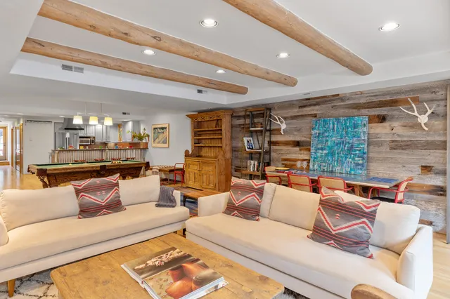 a kitchen with stainless steel appliances granite countertop a sink and a refrigerator