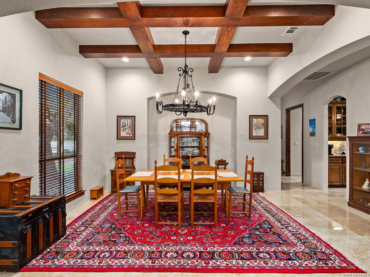 19819 Wild Hollow Garden Ridge, TX 78266 - Photo 13 of 68 a living room with a rug and a table
