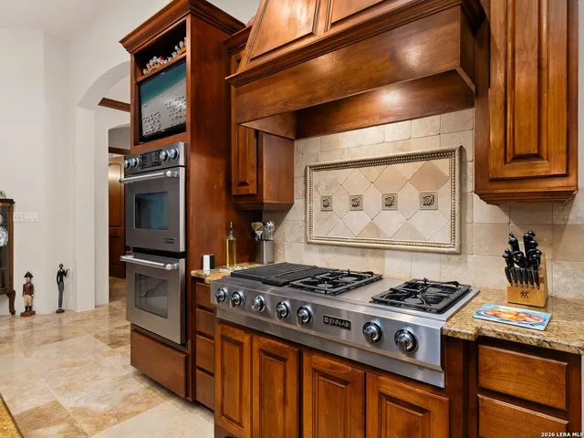 a bedroom with a bed couch and a window