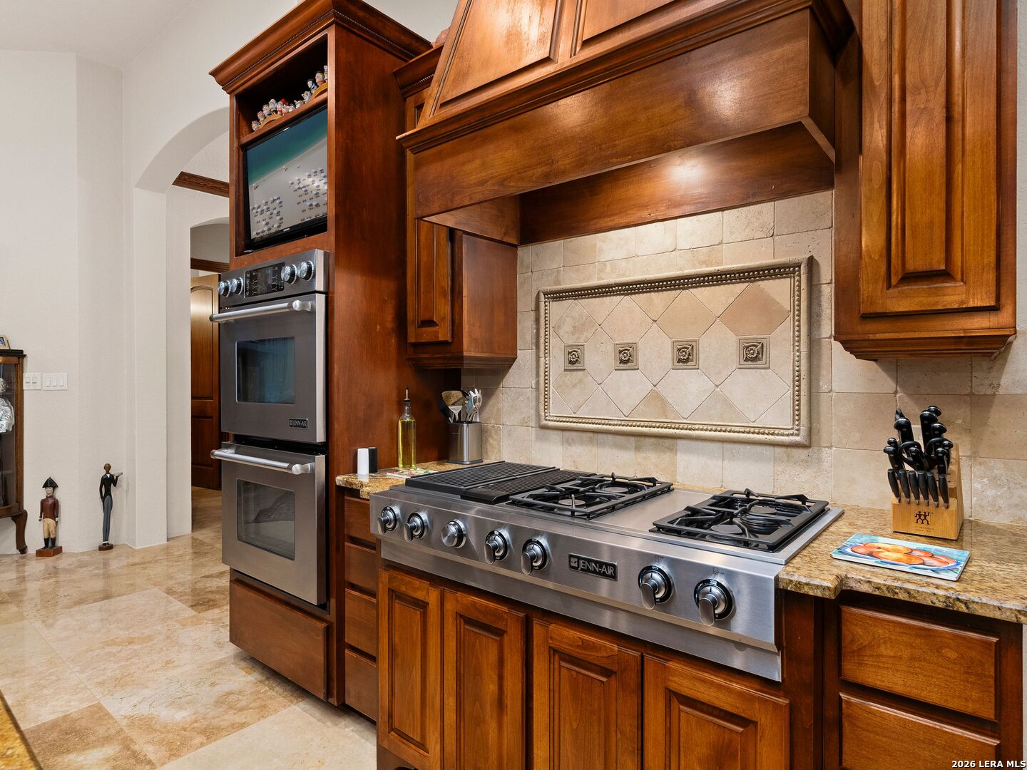 19819 Wild Hollow Garden Ridge, TX 78266 - Photo 22 of 68 a kitchen with a stove and a refrigerator