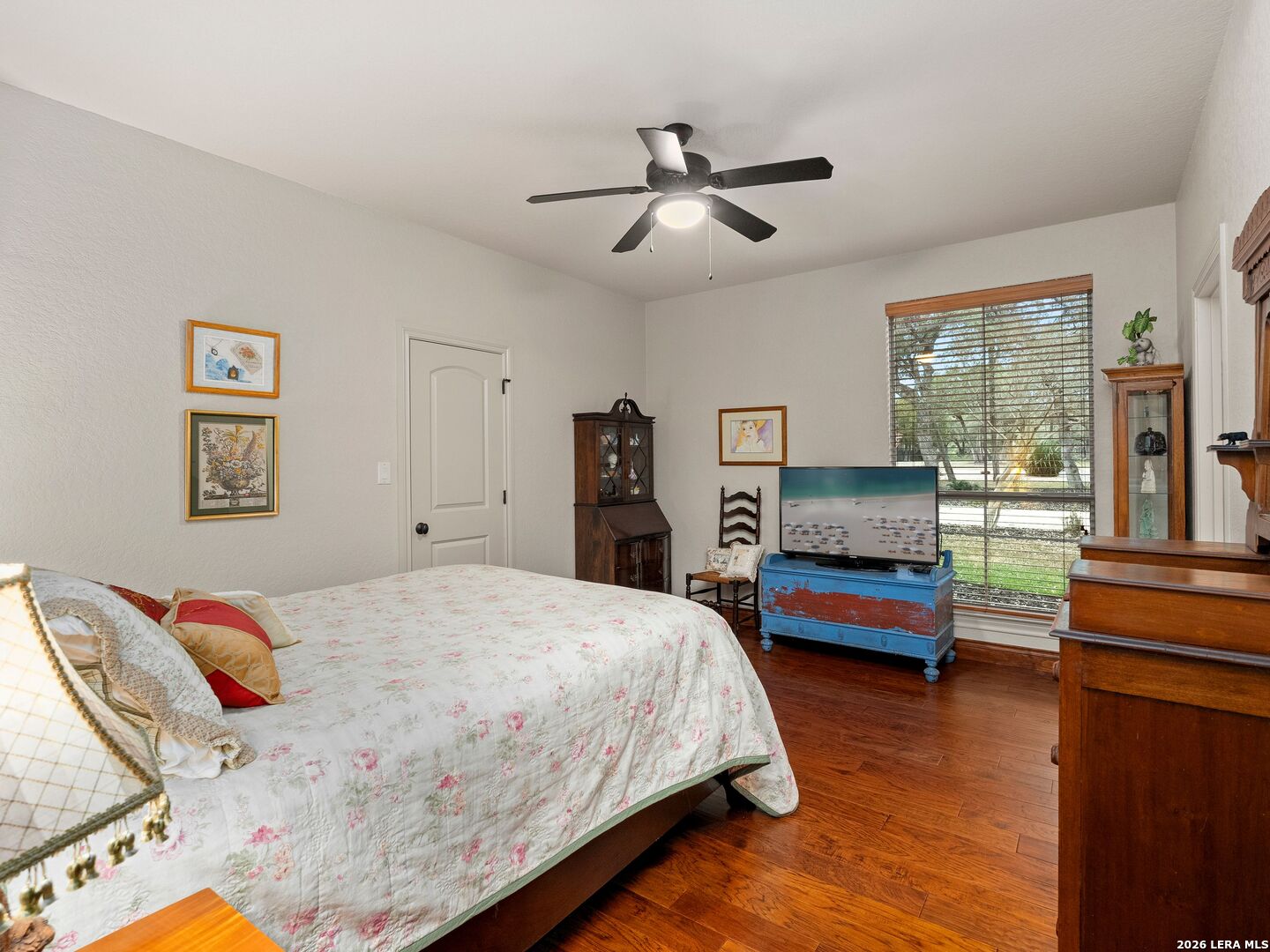 19819 Wild Hollow Garden Ridge, TX 78266 - Photo 25 of 68 a bedroom with a bed and furniture