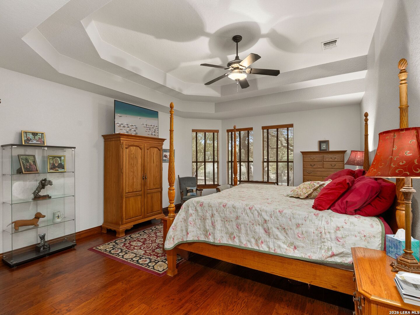 19819 Wild Hollow Garden Ridge, TX 78266 - Photo 26 of 68 a bedroom with a large bed and a window