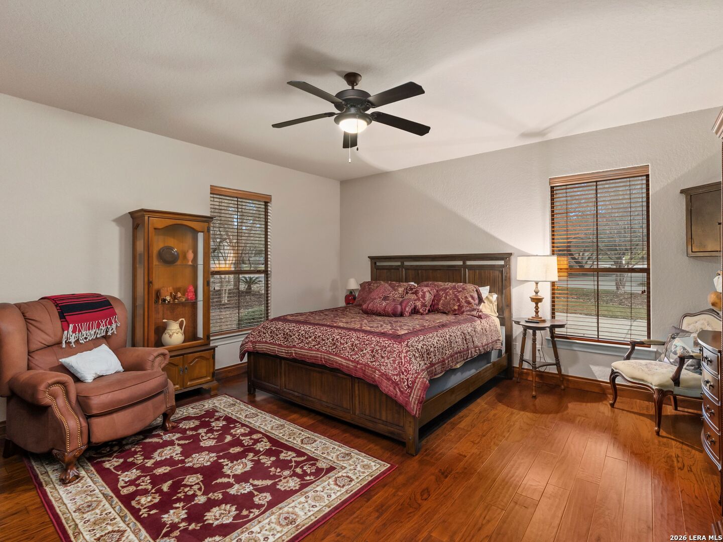 19819 Wild Hollow Garden Ridge, TX 78266 - Photo 30 of 68 a bedroom with a bed couch and a window