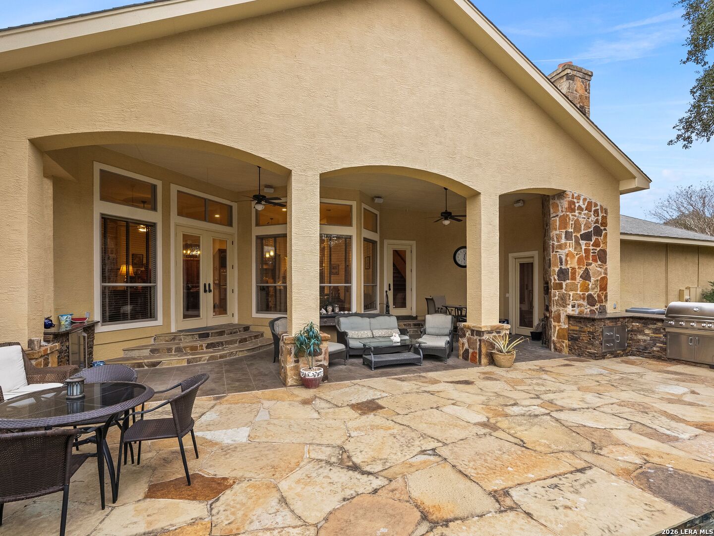 19819 Wild Hollow Garden Ridge, TX 78266 - Photo 38 of 68 a view of a brick house with outdoor seating
