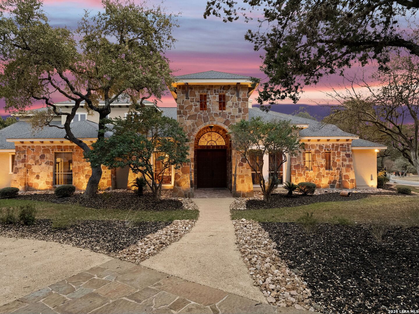 19819 Wild Hollow Garden Ridge, TX 78266 - Photo 42 of 68 a front view of a house with a yard