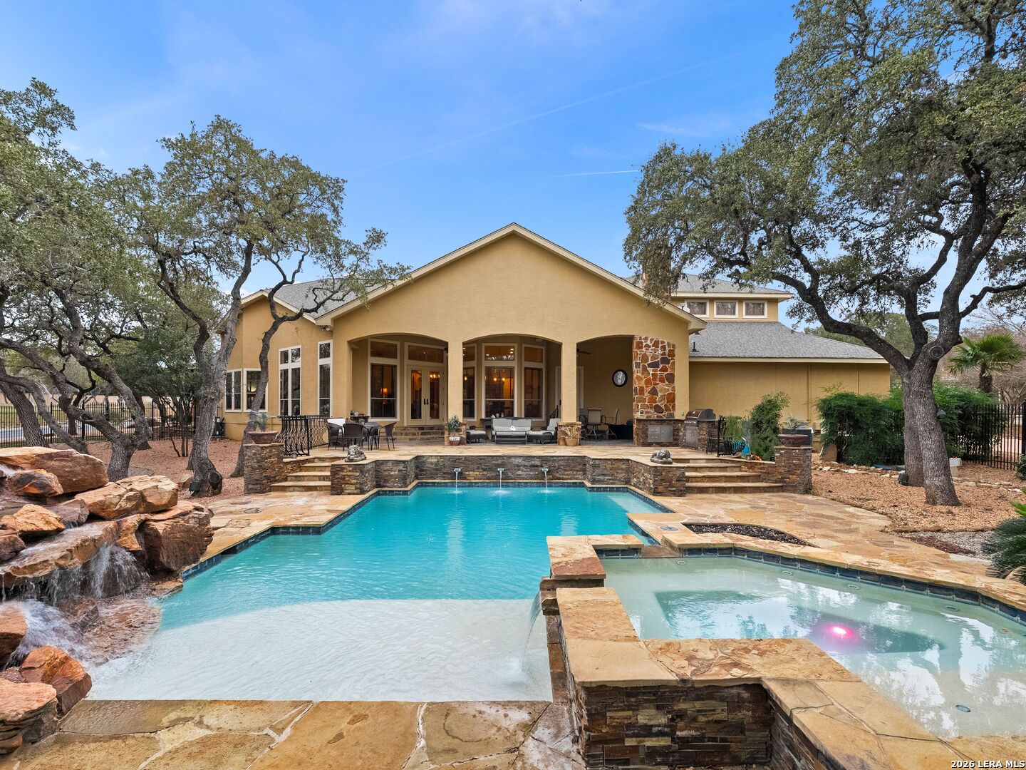 19819 Wild Hollow Garden Ridge, TX 78266 - Photo 46 of 68 a front view of a house with swimming pool and chairs